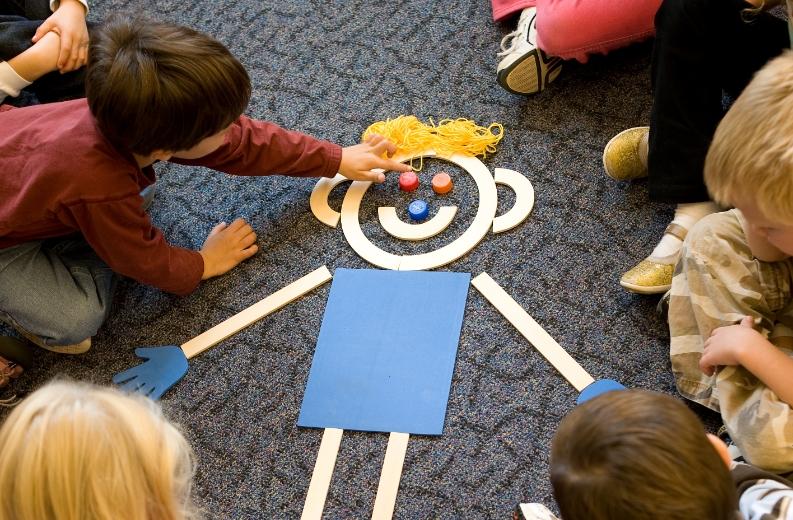 Students engaging with Mat Man for early learning and motor skills