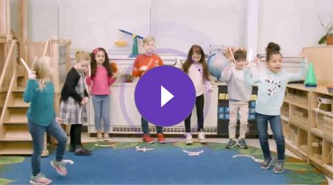 Thumbnail still of children following along with the Wood Piece Pokey song, holding wooden handwriting pieces shaped like capital letter parts, engaging in a fun, movement-based learning activity.